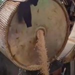 Fake pills pouring from industrial equipment