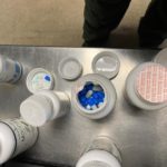 vitamin bottles with illicit pills in them