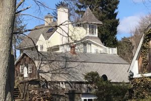 picture of a barn in front of a large house