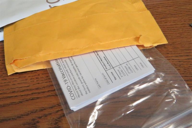 vaccine cards in a mailing envelope
