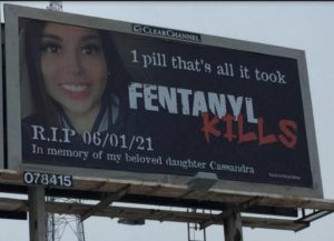 billboard with woman's face and fentanyl wanring
