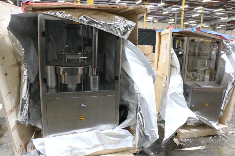 Smuggled pill press machines seized by CBP, are capable
of producing over 1 million capsules of illegal drugs per hour. (Source: DEA) 