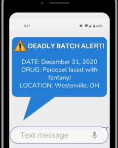Text message on a phone warning about dangerous drugs