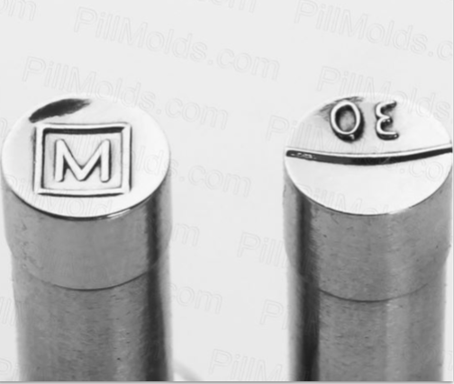 silver cylinders, one embossed with an M in a square; the other with a 30 over a line.