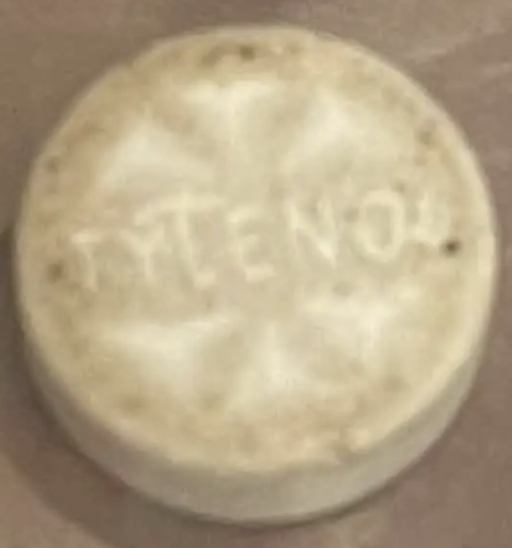 battered looking white pill