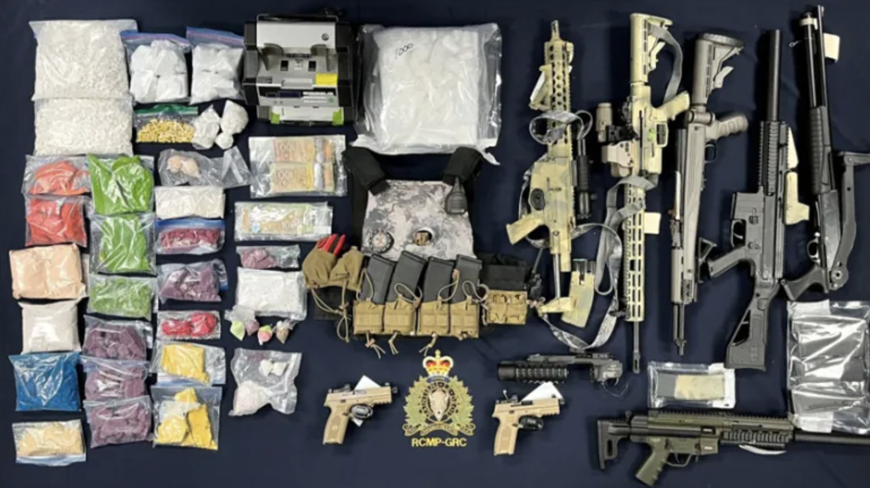 'Significant quantities' of drugs and weapons were seized during the execution of three search warrants, November 2022. (RCMP)