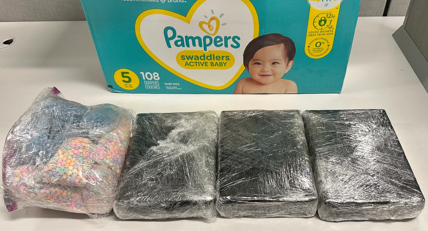 20,000 fentanyl pills and three kilograms of powdered fentanyl were hidden in a cardboard diaper box. (January 2023)