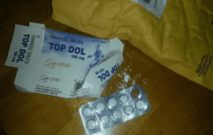 A smashed box of pills with a blister pack. it's labeled Top Dol,” an Indian formulation of the Schedule IV opioid, tramadol.