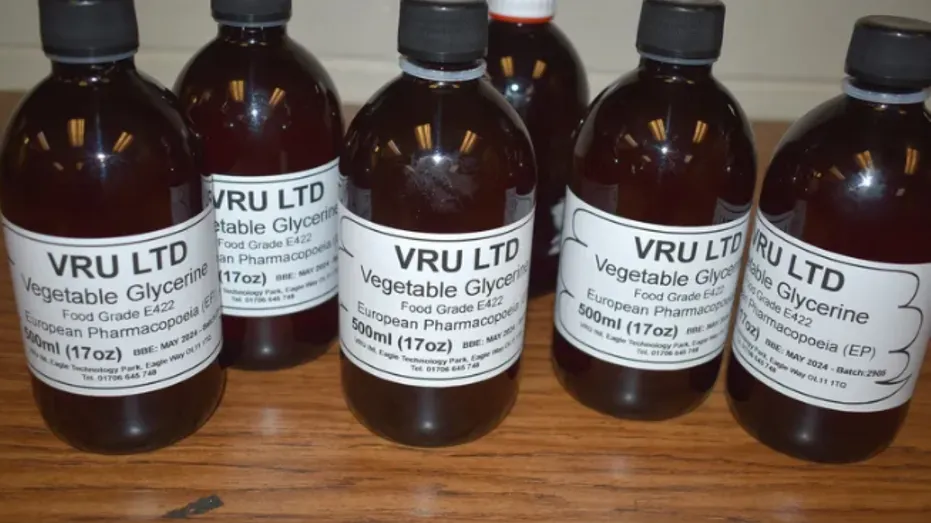 Dark bottles with white labels that say "vegetable glycerin.”