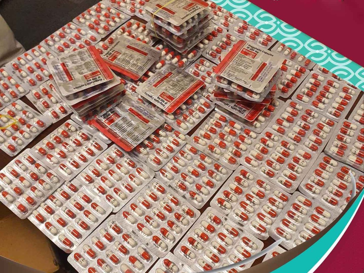 red pills in blister packs arranged on a flat surface