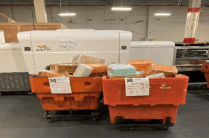 Large orange carts filled with seized items