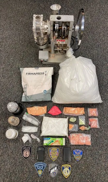 This drug seizure included a pill press, pill making supples and small baggies meth and fentanyl laced heroin