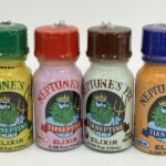 A closeup of brightly colored supplement bottles with "Neptune's Fix" labels