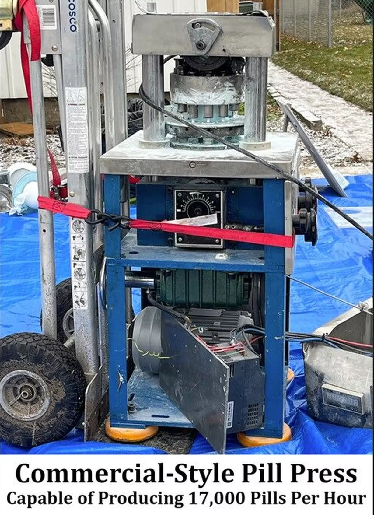 Picture of a large pill press on a blue tarp. A caption reads "A commercial pill press capable of churning out 17,000 fentanyl pills an hour."