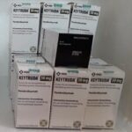 Boxes labeled Keytruda 50mg stacked on a white surface