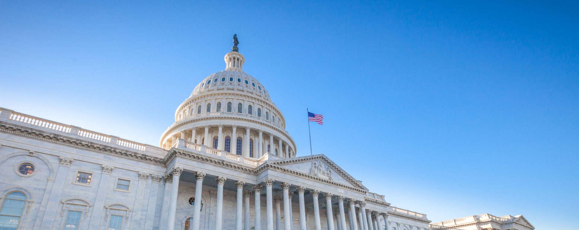 Low angled view of the U.S. Capitol East Facade Front in Washington, DC.